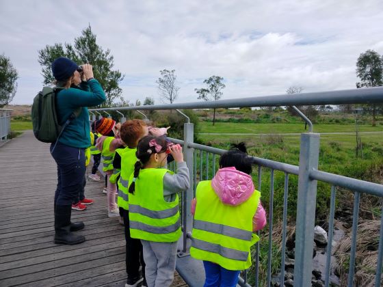 JuliaGaladaKinder looking at bird in binoculars Nov 24 560px